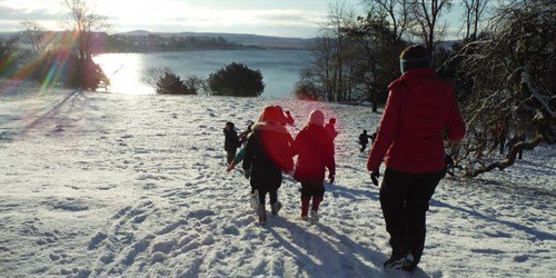 winter scene of school group in Malham Tarn
